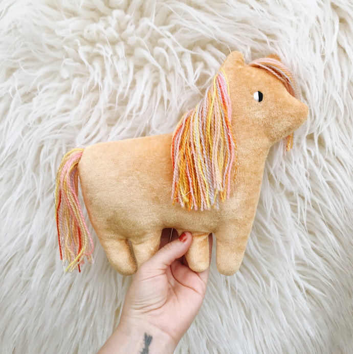 Tangerine Dream Pony with a rainbow mane - sleepy king